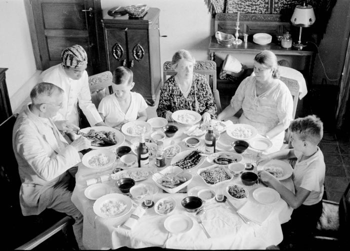 Dutch family eating rijsttaffel